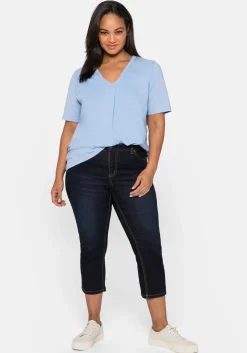 Caprijeans mit Kontrastnähten und Catfaces