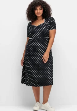 Jerseykleid mit Punktedruck und Paspelierung
