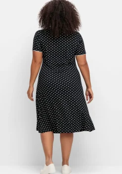 Jerseykleid mit Punktedruck und Paspelierung