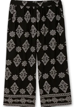 Schlupfhose mit Allover- und Bordürendruck