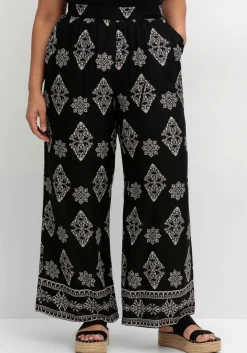 Schlupfhose mit Allover- und Bordürendruck