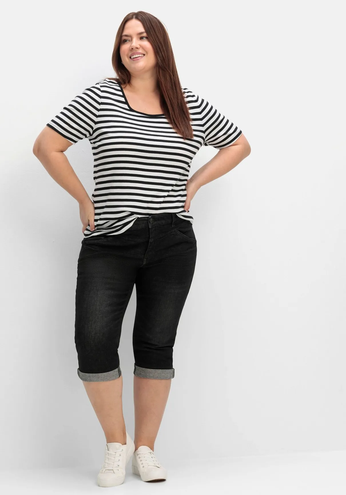 Schmale Caprijeans mit Used-Effekten