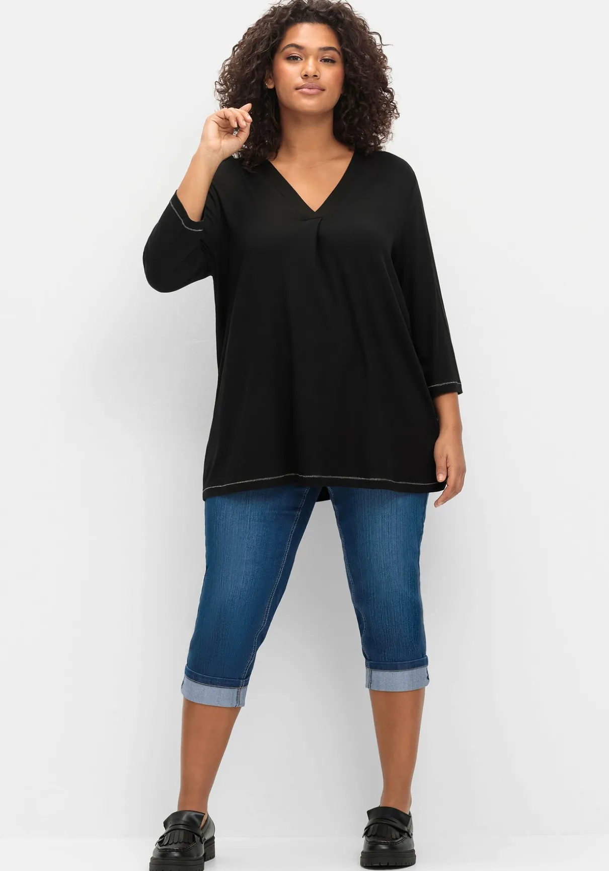 Schmale 7/8-Jeans mit Kontrasttape innen am Saum