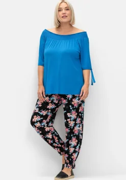 Weite Hose mit Blumendruck und Smok-Abschlüssen