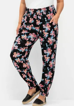 Weite Hose mit Blumendruck und Smok-Abschlüssen