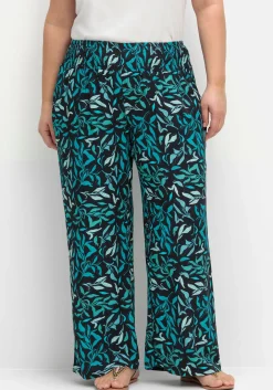 Weite Schlupfhose mit Smokbund und Blätterprint