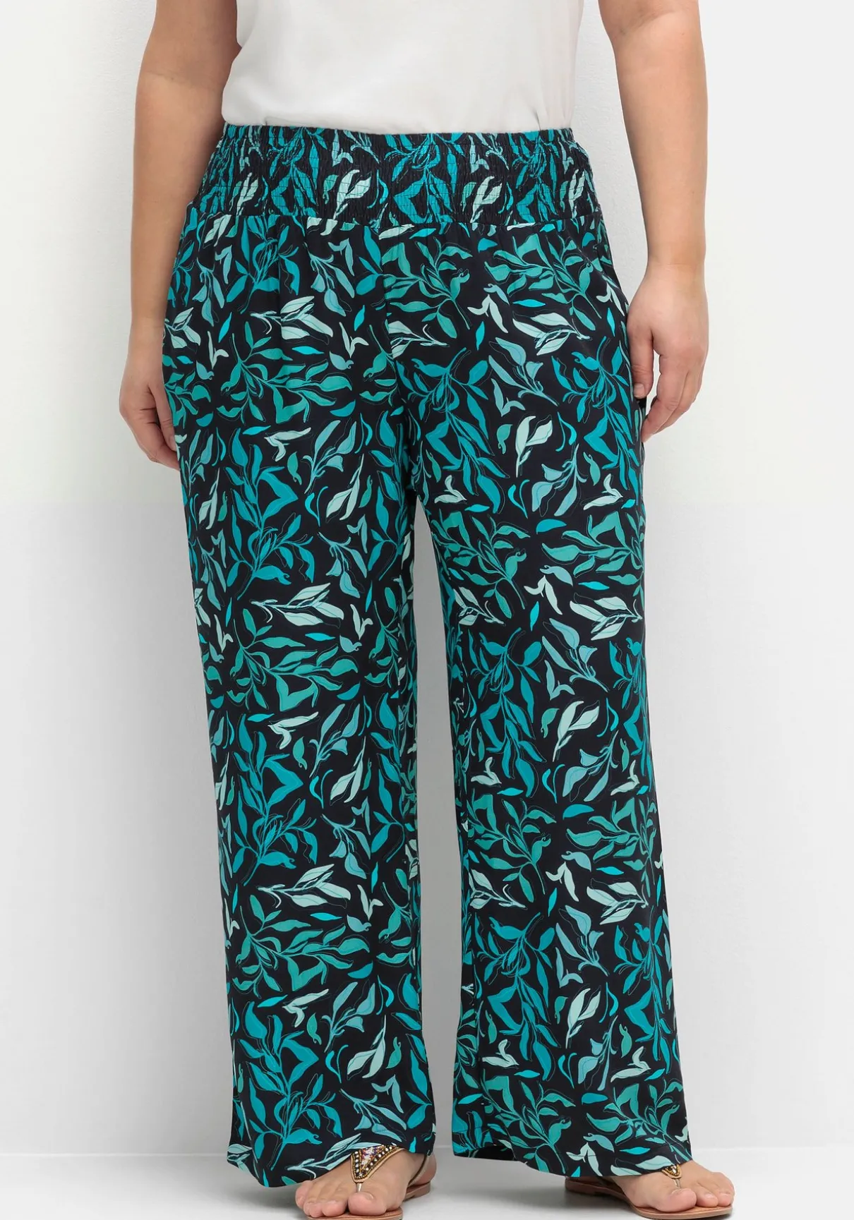 Weite Schlupfhose mit Smokbund und Blätterprint